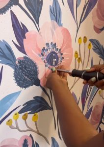 image of wallpaper covered light switch being replaced on wall