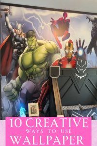 Superhero wallpaper behind a Black Panther bed.