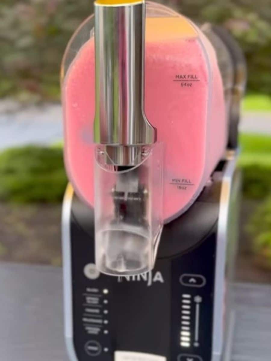 Ninja Slushi machine in black with pink slushi inside