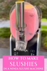 Ninja Slushi machine with pink slushie in it.