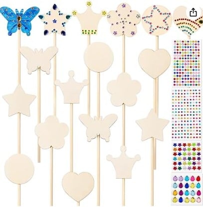 Wooden wands that have shapes on the top with some of them decorated with colors and jewels.