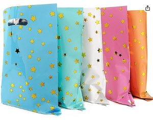 Multi colored goodie bags for a princess party with gold stars on them.