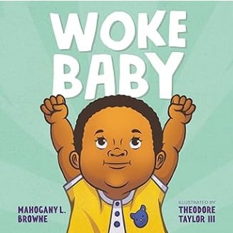 A greenish colored book with a young boy on the cover with his arms in the air and the words woke baby.